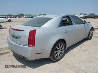 2009 Cadillac CTS RWD z VIN 1G6DV57V990149721, wystawiony jako IAAI lot #42293590 z przebiegiem 64 642 mil mil oraz . Historia ofert i sprzedaży dostępna na DreamBid. Obrazek 4.