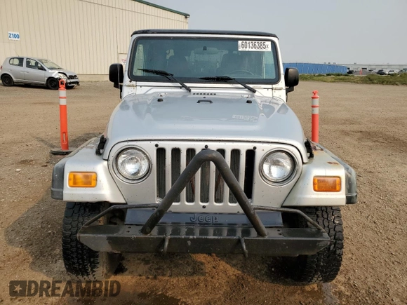 2003 Jeep Wrangler Sport z VIN 1J4FA49S93P306817, wystawiony jako Copart lot #60136385 z przebiegiem 217 208 mil mil oraz Czysty tytuł • Clean title. Historia ofert i sprzedaży dostępna na DreamBid. Obrazek 5.