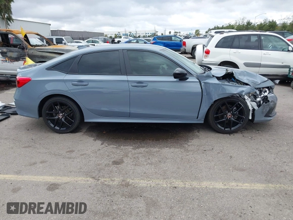 2022 Honda Civic Sport z VIN 2HGFE2F58NH569211, wystawiony jako IAAI lot #41784870 z przebiegiem 22 255 mil mil oraz . Historia ofert i sprzedaży dostępna na DreamBid. Obrazek 13.