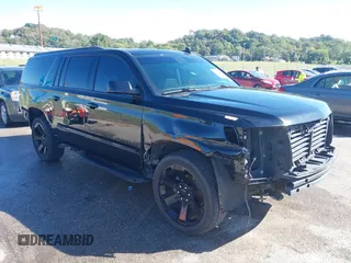 2019 Chevrolet Suburban Premier with VIN 1GNSKJKJ1KR100936, listed as a IAAI auction lot 40489121 with 97,884 mi miles and . Bid and sale history available at DreamBid. Image 1.