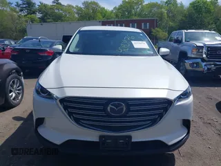 2021 Mazda CX-9 Touring z VIN JM3TCBCYXM0521323, wystawiony jako IAAI lot #42190976 z przebiegiem 56 652 mil mil oraz . Historia ofert i sprzedaży dostępna na DreamBid. Obrazek 12.