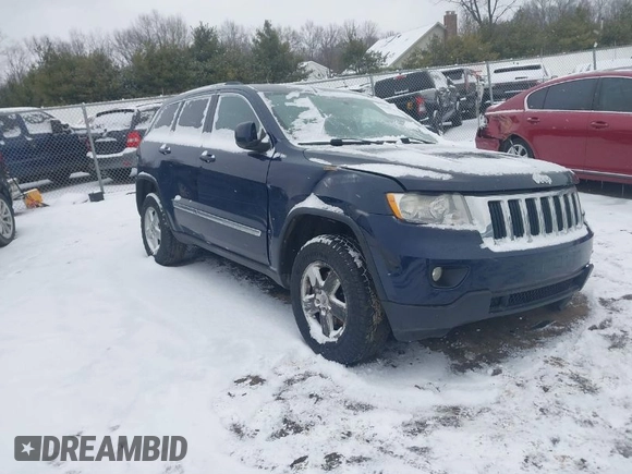 2013 Jeep Grand Cherokee Laredo with VIN 1C4RJFAGXDC542987, listed as a IAAI auction lot 41262770 with 199,273 mi miles. Bid and sale history available at carsss.com. Image 1.