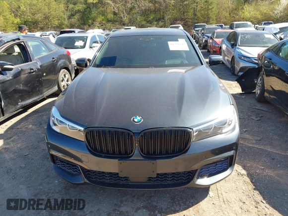 2017 BMW 7 Series 740i z VIN WBA7E2C57HG739465, wystawiony jako IAAI lot #41764778 z przebiegiem 84 814 mil mil oraz . Historia ofert i sprzedaży dostępna na DreamBid. Obrazek 13.