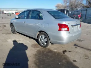 2010 Toyota Yaris with VIN JTDBT4K35A1369494, listed as a IAAI auction lot 41671076 with 154,918 mi miles. Bid and sale history available at carsss.com. Image 3.