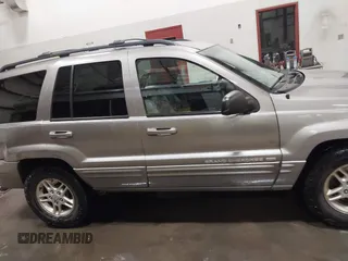 1999 Jeep Grand Cherokee Limited with VIN 1J4GW68N7XC752314, listed as a IAAI auction lot 41776905 with 228,023 mi miles. Bid and sale history available at carsss.com. Image 14.
