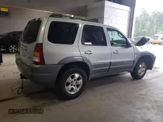 2001 Mazda Tribute LX with VIN 4F2CU08141KM65160, listed as a Copart auction lot 60895624 with 255,194 mi miles and Salvage Title. Bid and sale history available at carsss.com. Image 3.