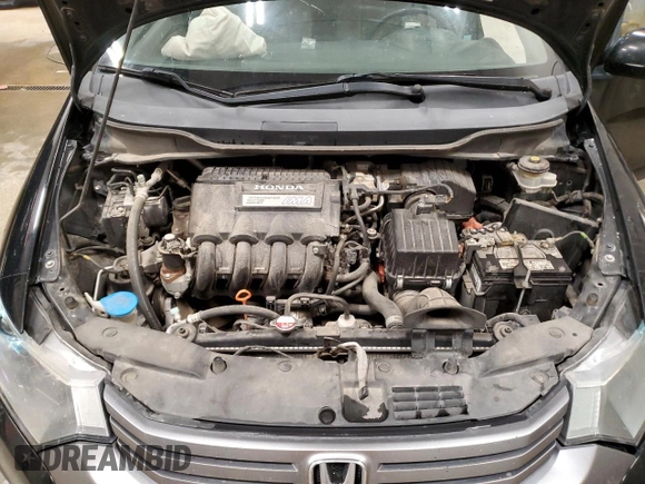 2010 Honda Insight EX z VIN JHMZE2H72AS009647, wystawiony jako Copart lot #60079205 z przebiegiem 157 844 mil mil oraz Czysty tytuł • Clean title. Historia ofert i sprzedaży dostępna na DreamBid. Obrazek 11.