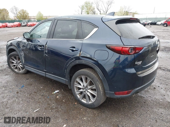 2019 Mazda CX-5 Grand Touring with VIN JM3KFBDM6K0592496, listed as a IAAI auction lot 41730103 with Not Provided miles and . Bid and sale history available at carsss.com. Image 3.