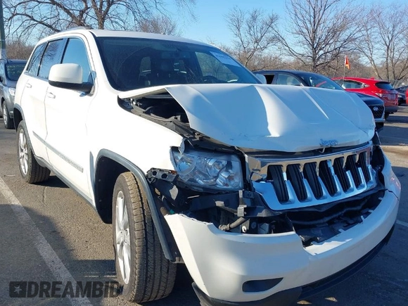 2012 Jeep Grand Cherokee Laredo with VIN 1C4RJFAG5CC310893, listed as a IAAI auction lot 41695279 with 136,821 mi miles. Bid and sale history available at carsss.com. Image 1.