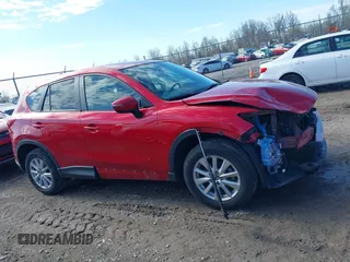 2016 Mazda CX-5 Touring with VIN JM3KE4CY5G0630438, listed as a IAAI auction lot 41877660 with 56,960 mi miles. Bid and sale history available at carsss.com. Image 14.