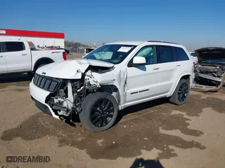 2018 Jeep Grand Cherokee Laredo E with VIN 1C4RJFAGXJC435658, listed as a IAAI auction lot 40659459 with 97,827 mi miles. Bid and sale history available at carsss.com. Image 2.