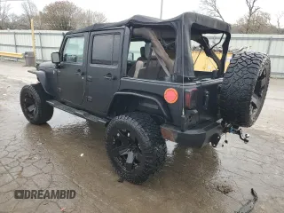 2007 Jeep Wrangler Unlimited X with VIN 1J4GA391X7L171902, listed as a Copart auction lot 82150334 with 167,695 mi miles and Salvage title. Bid and sale history available at DreamBid. Image 2.