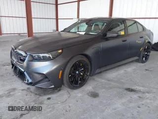2025 BMW 5 Series with VIN WBS83FK04SCU11874, listed as a IAAI auction lot 42543784 with 4,517 mi miles and . Bid and sale history available at DreamBid. Image 19.