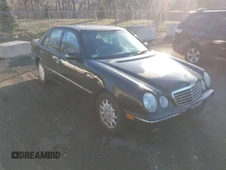 2000 Mercedes-Benz E-Class with VIN WDBJF65J1YB058351, listed as a IAAI auction lot 41834603 with 100,525 mi miles. Bid and sale history available at carsss.com. Image 1.