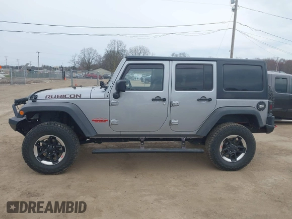 2015 Jeep Wrangler Unlimited Rubicon with VIN 1C4BJWFG1FL546018, listed as a IAAI auction lot 42060045 with 107,249 mi miles and . Bid and sale history available at DreamBid. Image 15.