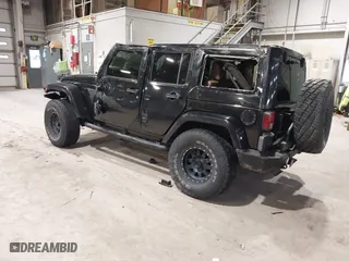 2011 Jeep Wrangler Unlimited Sahara with VIN 1J4HA5H12BL557059, listed as a IAAI auction lot 41856882 with 150,683 mi miles. Bid and sale history available at carsss.com. Image 3.
