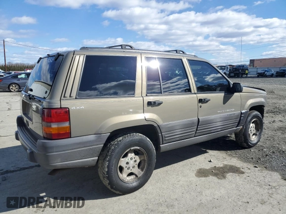 1997 Jeep Grand Cherokee Laredo with VIN 1J4GZ58SXVC569171, listed as a Copart auction lot 45657745 with 101,648 mi miles and Salvage Title. Bid and sale history available at carsss.com. Image 3.