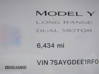 2024 Tesla Model Y Long Range with VIN 7SAYGDEE1RF056816, listed as a IAAI auction lot 41809125 with 6,434 mi miles and . Bid and sale history available at DreamBid. Image 16.