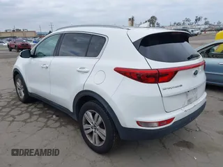 2018 Kia Sportage LX with VIN KNDPM3AC1J7413227, listed as a IAAI auction lot 42188566 with 77,897 mi miles and . Bid and sale history available at carsss.com. Image 3.