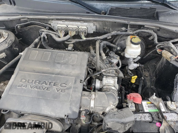2010 Mercury Mariner Premier with VIN 4M2CN8HG3AKJ16128, listed as a Copart auction lot 58649895 with 157,798 mi miles and Salvage title. Bid and sale history available at DreamBid. Image 12.