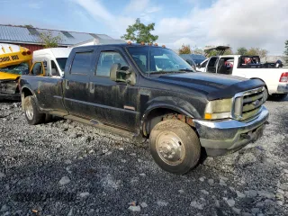 2003 Ford F-450 XL with VIN 1FDXW46P13EC18704, listed as a Copart auction lot 73657814 with 153,552 mi miles and Salvage Title. Bid and sale history available at carsss.com. Image 4.