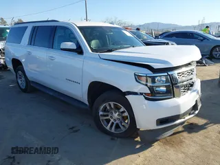 2015 Chevrolet Suburban LT z VIN 1GNSCJKC2FR680413, wystawiony jako IAAI lot #41634666 z przebiegiem 127 175 mil mil oraz . Historia ofert i sprzedaży dostępna na DreamBid. Obrazek 1.