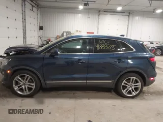 2015 Lincoln MKC with VIN 5LMTJ2AH0FUJ28744, listed as a IAAI auction lot 41888775 with 145,872 mi miles. Bid and sale history available at carsss.com. Image 14.