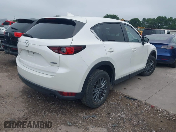 2017 Mazda CX-5 Touring z VIN JM3KFBCL5H0128584, wystawiony jako IAAI lot #42354669 z przebiegiem 56 563 mil mil oraz . Historia ofert i sprzedaży dostępna na DreamBid. Obrazek 4.