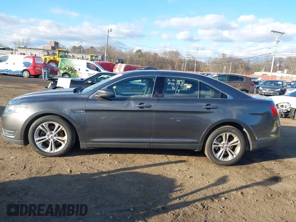 2015 Ford Taurus SEL with VIN 1FAHP2H86FG174102, listed as a IAAI auction lot 40997366 with 132,543 mi miles. Bid and sale history available at carsss.com. Image 14.