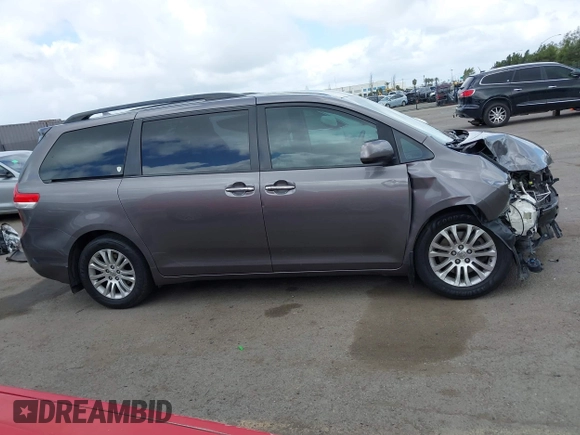 2014 Toyota Sienna XLE with VIN 5TDYK3DC7ES517206, listed as a IAAI auction lot 41945572 with 128,743 mi miles and . Bid and sale history available at DreamBid. Image 14.