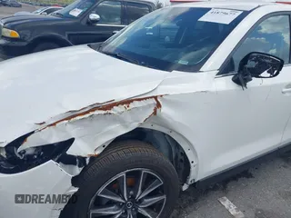 2018 Mazda CX-5 Touring z VIN JM3KFACM6J1419663, wystawiony jako IAAI lot #41879677 z przebiegiem 115 224 mil mil oraz . Historia ofert i sprzedaży dostępna na DreamBid. Obrazek 20.