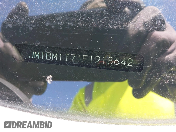 2015 Mazda 3 i SV with VIN JM1BM1T71F1218642, listed as a IAAI auction lot 42142795 with 134,143 mi miles. Bid and sale history available at carsss.com. Image 9.