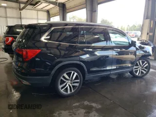 2017 Honda Pilot Touring with VIN 5FNYF6H97HB036935, listed as a Copart auction lot 71757334 with 68,641 mi miles and Salvage Title. Bid and sale history available at DreamBid. Image 3.