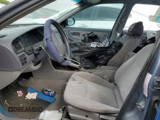 1999 Nissan Altima XE z VIN 1N4DL01D9XC148205, wystawiony jako Copart lot #50392305 z przebiegiem 90 698 mil mil oraz Szkoda całkowita • Salvage title. Historia ofert i sprzedaży dostępna na DreamBid. Obrazek 7.