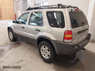 2004 Ford Escape XLT with VIN 1FMYU93164KB05521, listed as a IAAI auction lot 41723219 with 246,369 mi miles. Bid and sale history available at carsss.com. Image 3.