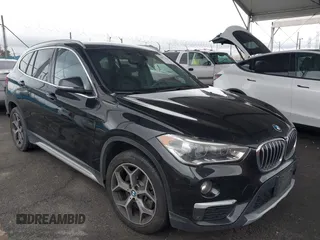 2019 BMW X1 sDrive28i with VIN WBXHU7C54K3H45266, listed as a IAAI auction lot 41572498 with 81,303 mi miles. Bid and sale history available at carsss.com. Image 1.