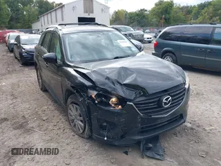 2016 Mazda CX-5 Sport with VIN JM3KE2BE8G0804398, listed as a IAAI auction lot 40490953 with 116,279 mi miles and . Bid and sale history available at DreamBid. Image 6.