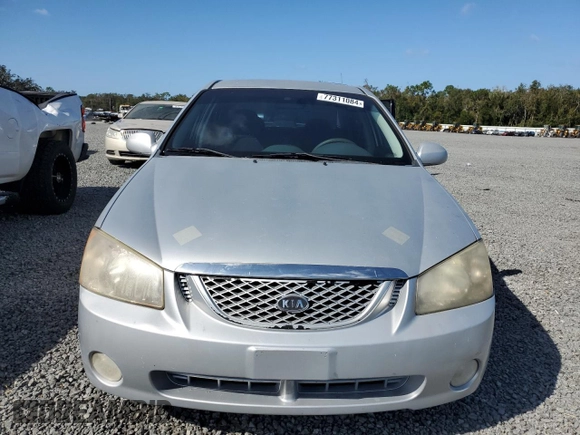 2006 Kia Spectra EX with VIN KNAFE121365229594, listed as a Copart auction lot 77311084 with 129,789 mi miles and Salvage Title. Bid and sale history available at carsss.com. Image 5.