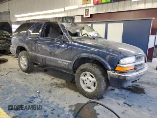 2000 Chevrolet Blazer LS z VIN 1GNCT18WXYK132399, wystawiony jako Copart lot #87880555 z przebiegiem 89 350 mil mil oraz Czysty tytuł • Clean title. Historia ofert i sprzedaży dostępna na DreamBid. Obrazek 4.