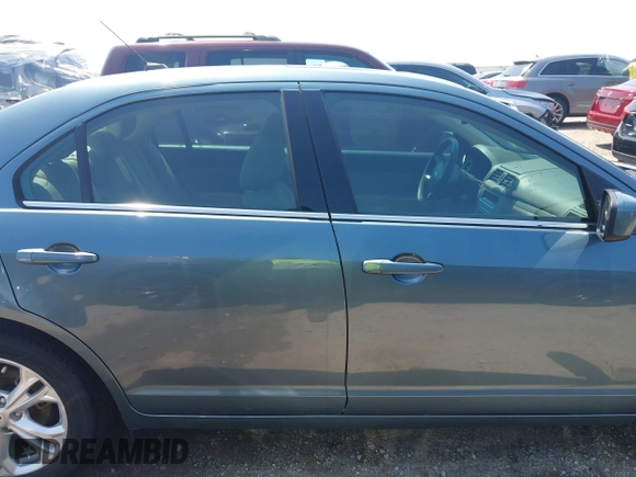 2012 Ford Fusion SE z VIN 3FAHP0HA4CR209490, wystawiony jako IAAI lot #42376506 z przebiegiem 145 622 mil mil oraz . Historia ofert i sprzedaży dostępna na DreamBid. Obrazek 13.