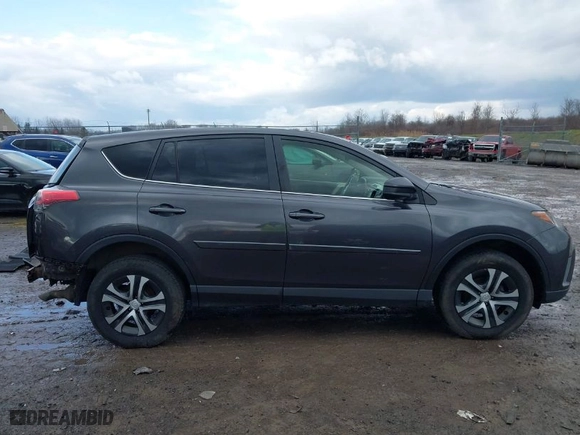 2018 Toyota RAV4 LE with VIN JTMBFREV8JJ184809, listed as a IAAI auction lot 41901048 with 76,699 mi miles. Bid and sale history available at carsss.com. Image 14.