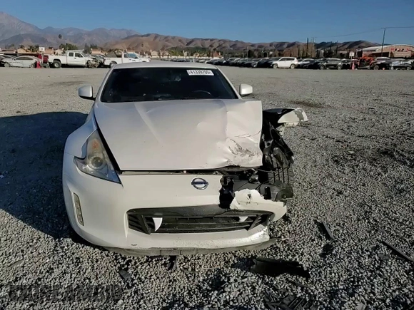 2014 Nissan 370Z Touring with VIN JN1AZ4EH7EM637101, listed as a Copart auction lot 41339705 with 105,841 mi miles and Salvage Title. Bid and sale history available at carsss.com. Image 11.