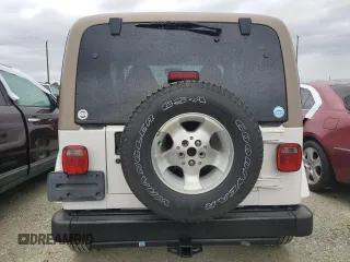 2002 Jeep Wrangler Sahara with VIN 1J4FA59S02P727359, listed as a Copart auction lot 74823414 with 84,186 mi miles and Salvage Title. Bid and sale history available at carsss.com. Image 6.