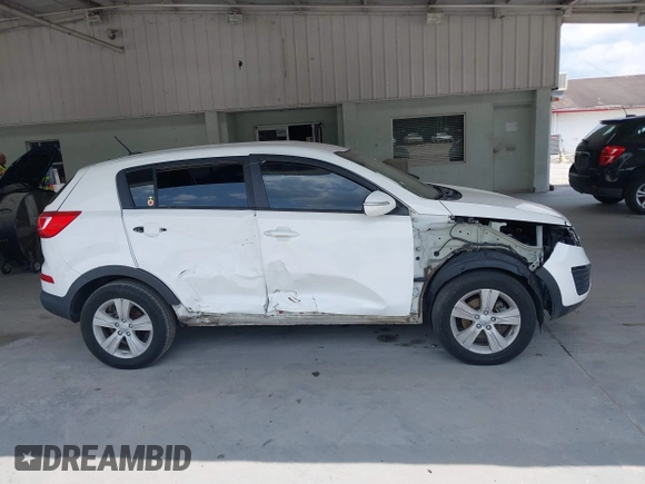 2013 Kia Sportage LX z VIN KNDPB3A2XD7521010, wystawiony jako IAAI lot #42297975 z przebiegiem 134 826 mil mil oraz . Historia ofert i sprzedaży dostępna na DreamBid. Obrazek 14.