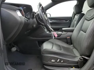 2023 Cadillac XT6 FWD Premium Luxury with VIN 1GYKPCRS5PZ220616, listed as a Copart auction lot 56913725 with 25,860 mi miles and Salvage title. Bid and sale history available at DreamBid. Image 7.