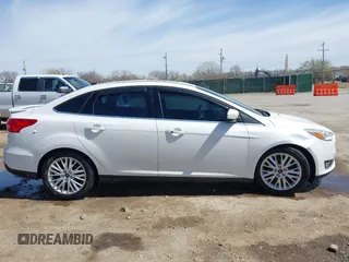2015 Ford Focus Titanium с VIN 1FADP3J27FL341102, выставлен на аукционе IAAI как лот 41793450 с пробегом 96 465 миль миль и . История ставок и продаж доступна на DreamBid. Изображение 13.
