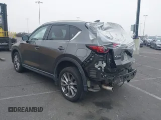 2021 Mazda CX-5 Grand Touring with VIN JM3KFADM2M1340669, listed as a IAAI auction lot 41916687 with 83,872 mi miles. Bid and sale history available at carsss.com. Image 3.