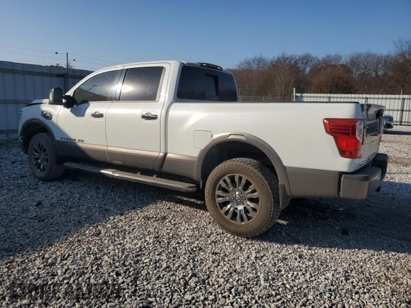 2016 Nissan Titan XD Platinum Reserve with VIN 1N6BA1F47GN510930, listed as a Copart auction lot 82561154 with 146,989 mi miles and Salvage Title. Bid and sale history available at carsss.com. Image 2.