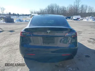 2025 Tesla Model Y Long Range with VIN 7SAYGDED0SF256230, listed as a IAAI auction lot 41356520 with 262 mi miles and . Bid and sale history available at DreamBid. Image 16.