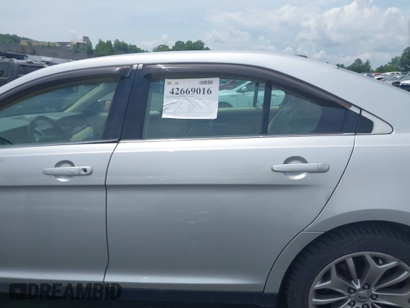 2014 Ford Taurus Limited with VIN 1FAHP2F82EG132673, listed as a IAAI auction lot 42669016 with 125,567 mi miles and . Bid and sale history available at DreamBid. Image 14.